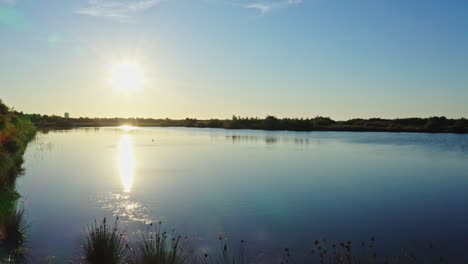 sunset over a lake near valras-plage aerial shot france