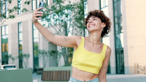 young woman taking a selfie in a city