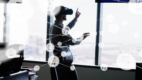 Animation-of-networks-of-connections-and-businessman-wearing-phone-vr-headset