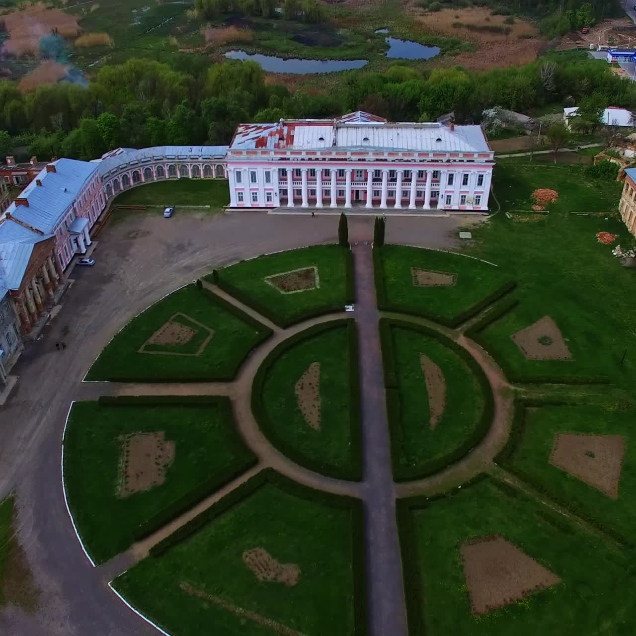 Flight over historical palaces in Tulchin, Vinnytsia region, Ukraine. Top vie wof the old residence and surrounding inhabited landscape