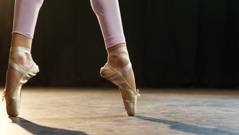 Graceful-ballerina-standing-on-pointe-4k