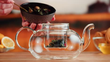 making fresh loose leaf tea in a glass teapot
