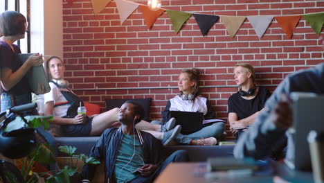 young adults relaxing and collaborating in a coworking space