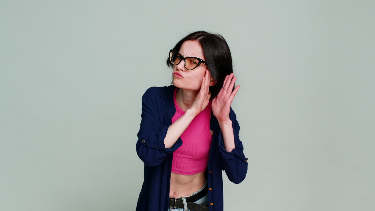 Woman playfully knocking imitating knockknock joke leaning forward smiling humorously asking who