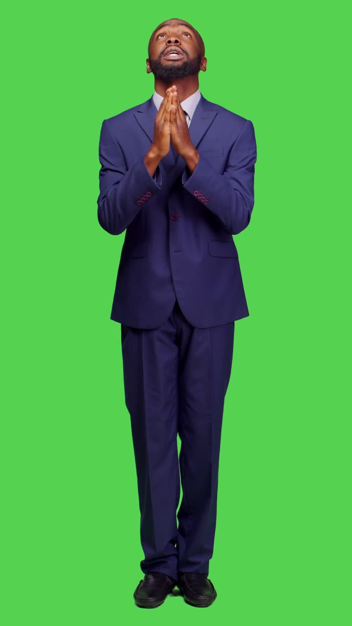 Vertical video: Front view of startup entrepreneur praying to god for good luck