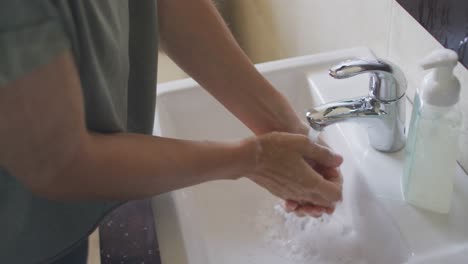 Woman-in-self-isolation-in-quarantine-during-coronavirus-pandemic-washing-he-r-hands