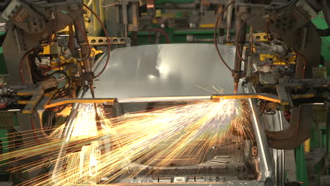 "a detailed view inside moroccan automobile factories, where skilled workers and automated machinery collaborate on assembling cars efficiently on the production line."
