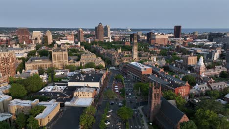 new haven city in connecticut at sunset time. downtown with historic buildings, towers and churches. brick design in american town. university campus and