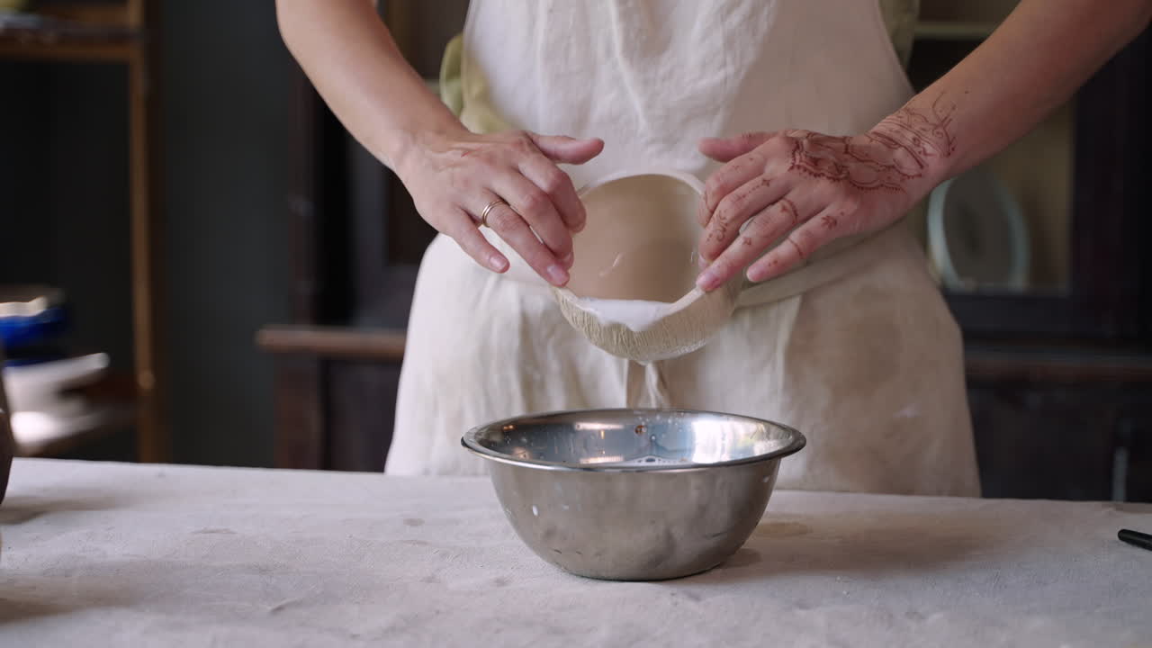 Woman creating ceramic bowls