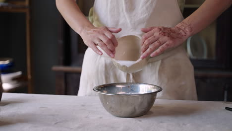 woman creating ceramic bowls