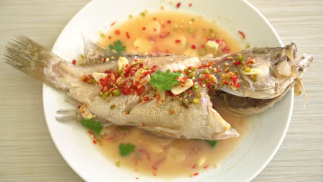 steamed grouper fish with lime and chillies - asian food style