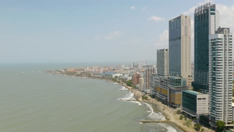 aerial establishing shot, cartagena skyscrapers, old city in background