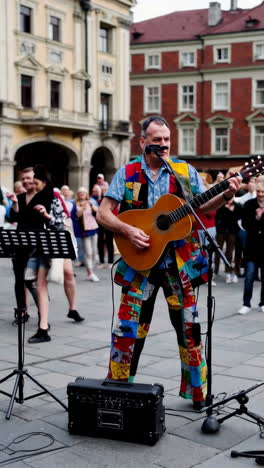 street musician playing acoustic guitar in a city square