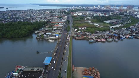 aerial shot showing a military convoy on a bridge in buenaventura colombia