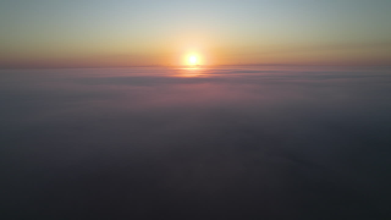 Flying on Top of Clouds Sunrise Aerial