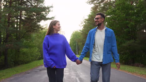 couple walking and running in a road