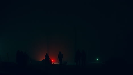 people walking in foggy night city