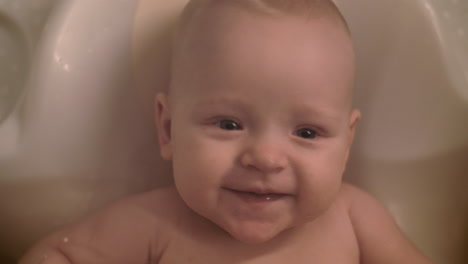 Cheerful-baby-girl-bathing