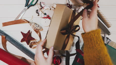 colorful alternate christmas and new year holidays gift boxes on wood table with blank space at the end - top view, stop motion