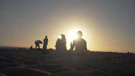 Couple-Sat-On-Venice-Beach