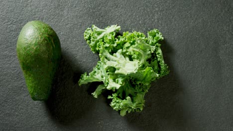 avocado and mustard greens on grey background 4k 4k