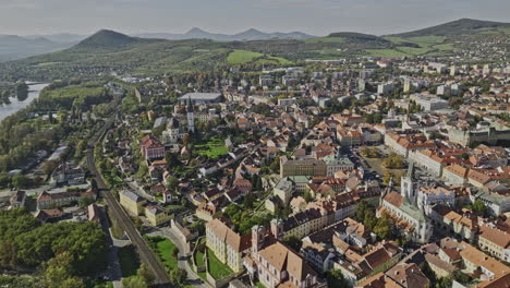 litomerice czechia aerial v3 panoramic panning view, drone flyover town center at the bank of elbe river capturing charming townscape and hillside landscape - shot with mavic 3 cine - november 2022