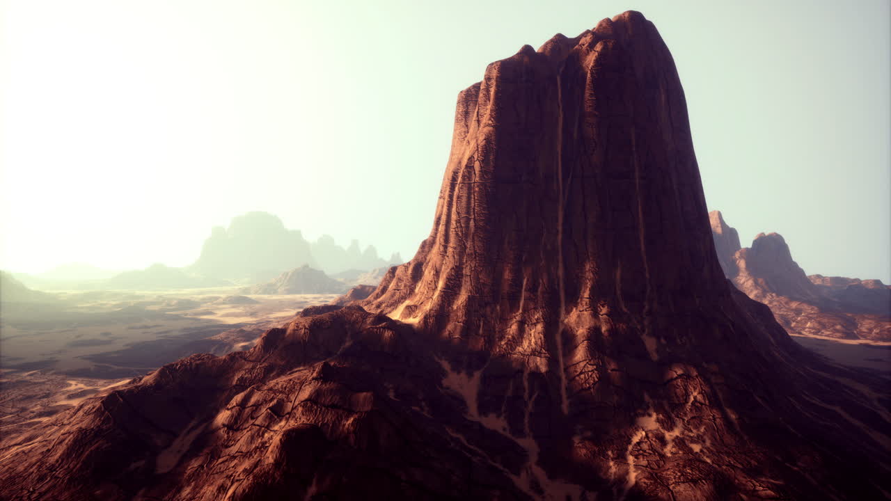 황금빛의 빛 아래의 장엄한 바위 형성이 광활한 사막 풍경에서