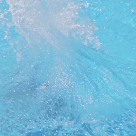 Boy jumping in pool