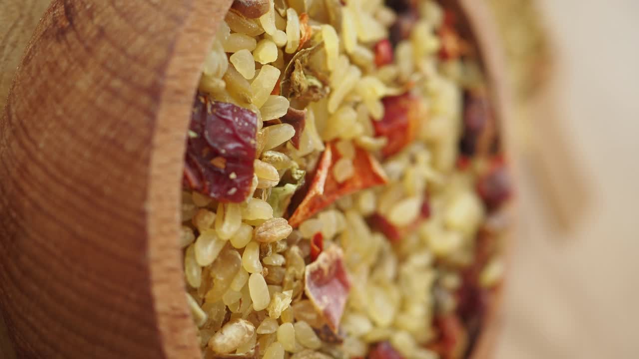 Mixed Bulgur with Spices in Wooden Bowl