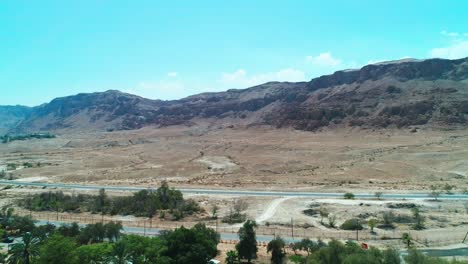 drone shot of a green settlement in the desert