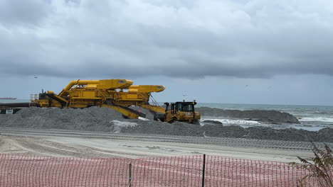 beach renourishment project with heavy machinery