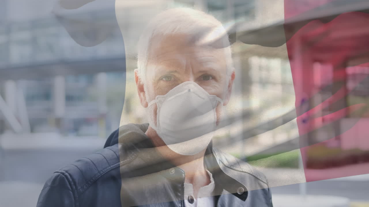 Animazione della bandiera della Francia che sventola sopra un uomo che indossa una mascherina durante la pandemia di COVID-19.
