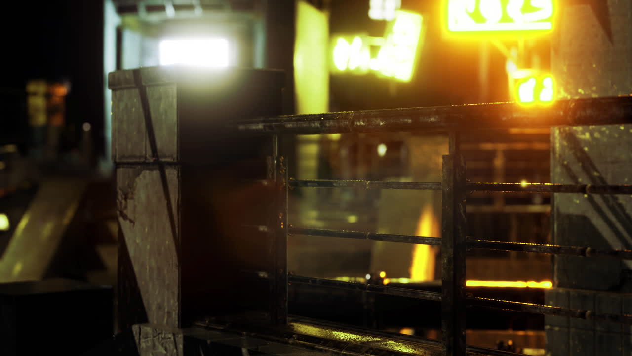 Urban night view featuring illuminated signs and wet surfaces in a cityscape