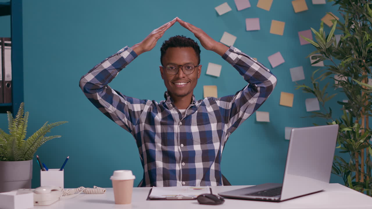 Confident person doing house roof symbol feeling safe