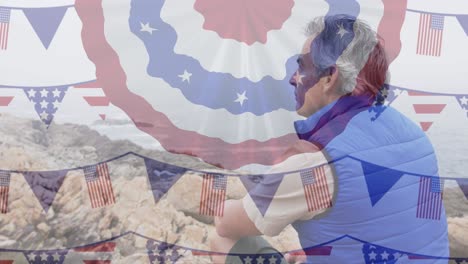 animación de la bandera de los estados unidos de américa sobre el hombre mayor en las montañas