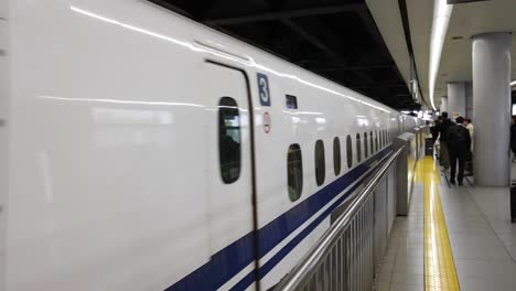 passengers boarding and alighting a bullet train