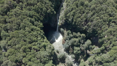 AERIAL---Rio-Bonito-waterfall-and-forest,-Patagonia,-Neuquen,-Argentina,-lowering
