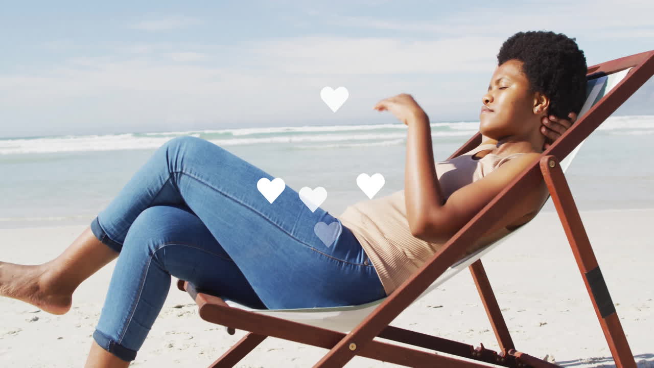 Woman reclining on deck chair, embracing social media design with floating heart icons over beach
