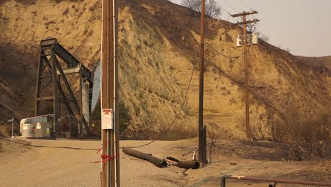 a telephone line is burned in half and destroyed causing a power failure during the thomas fire in ventura county california