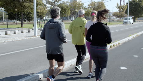 active elder runners jogging outside