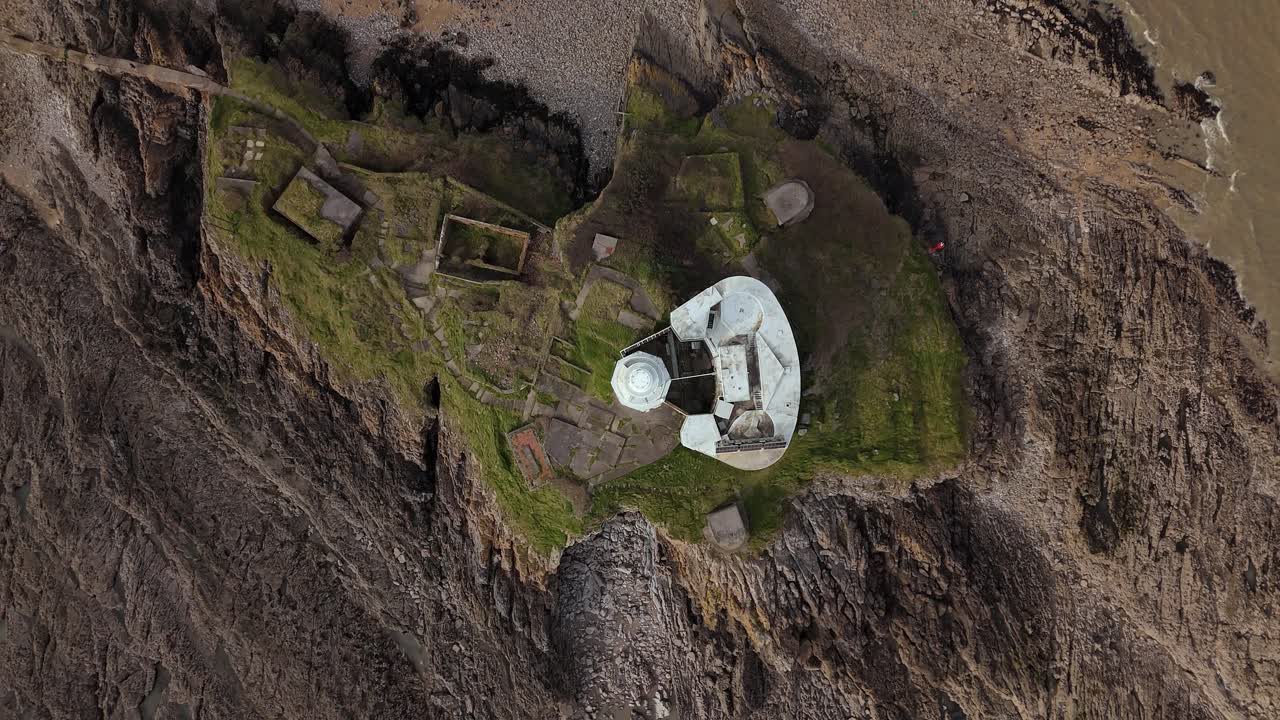 Aerial top shot of roof of Mumbles Lighthouse near muddy Swansea at United Kingdom.