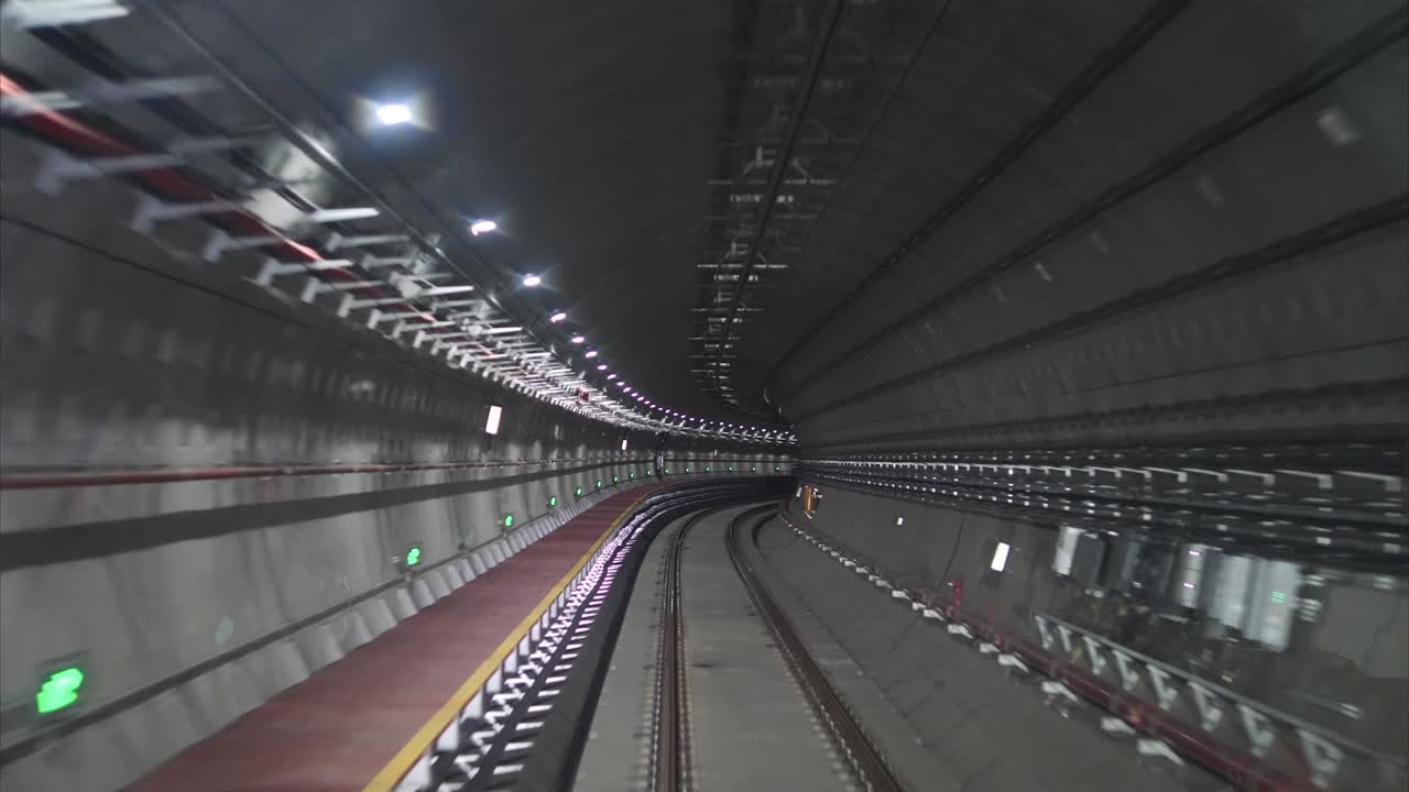 Time lapse automatic train driving in tunnel, subway journey view in dark tunnel fast speed 4k footage.
