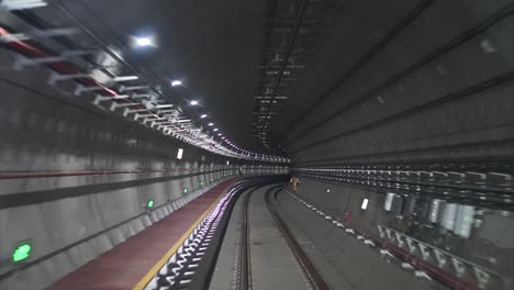 time lapse automatic train driving in tunnel, subway journey view in dark tunnel fast speed 4k footage.