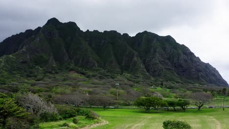 Drone-shot-of-the-woodlands-surrounding-Kualoa-Ranch-on-Oahu,-Hawaii