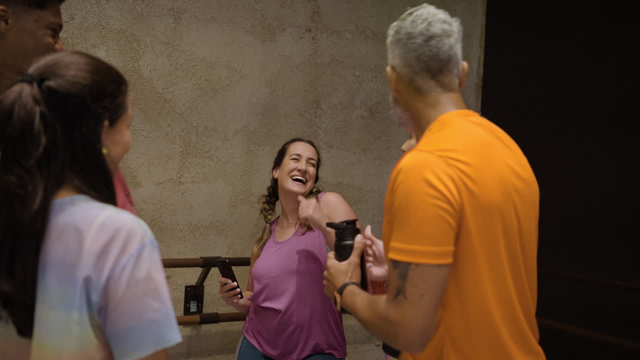 Group of friends laughing and socializing indoors