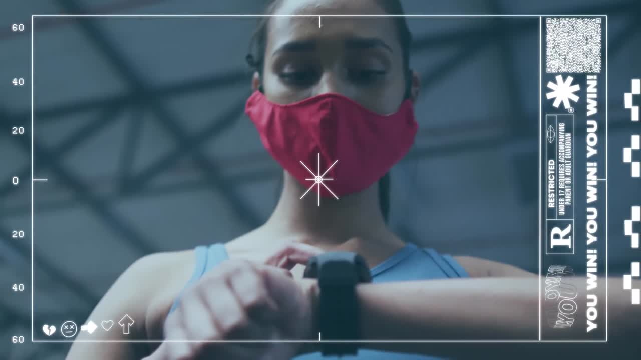 체육관에서 스마트 워치를 사용하는 얼굴 마스크를 착용 한 여성에 대한 게임 인터페이스