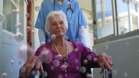 animation of coronavirus covid-19 cells spreading over senior caucasian woman and medical worker