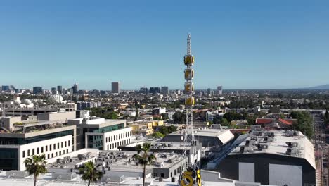 KTLA-5-television-broadcasting-tower-with-the-Los-Angeles-skyline-in-the-background---rising-aerial