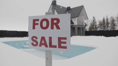 for sale banner on a house