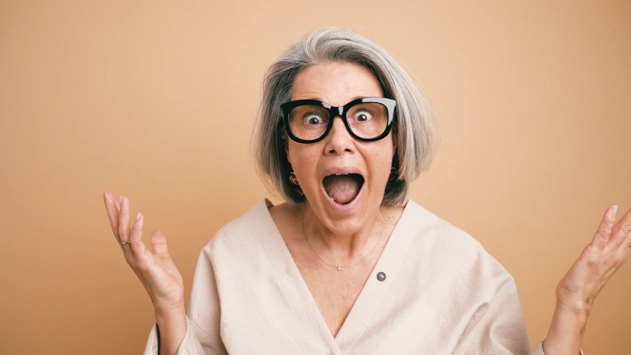 Surprised Mature Woman Expressing Shock and Disbelief